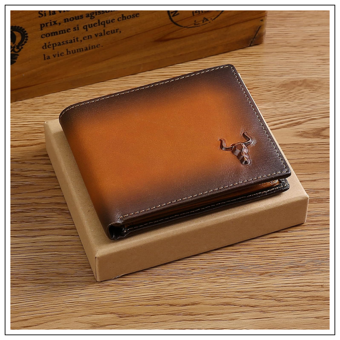 MING CLAN handcrafted Italian leather wallet placed on top of a minimal kraft gift box, featuring the signature embossed bull head logo.