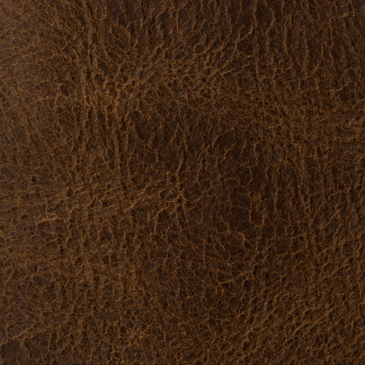 Close-up of a rugged MING CLAN brown full grain leather men's bifold wallet showing natural texture and patina.