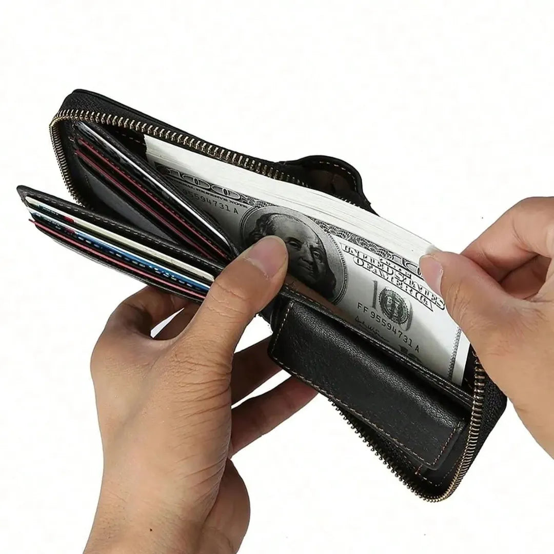 Hands opening the full-length bill compartment of MING CLAN black leather zipper wallet, demonstrating its large capacity.
