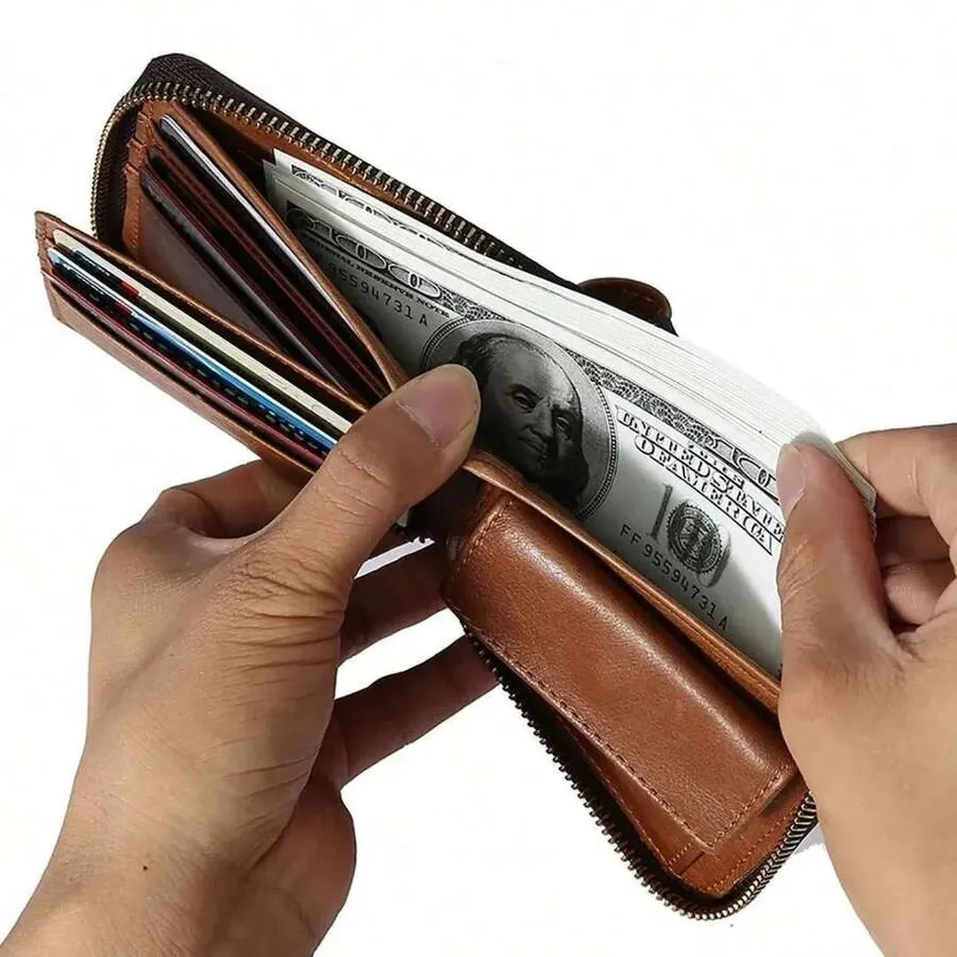 MING CLAN brown vintage cowhide leather zipper wallet held open in hands, fully loaded with US cash and credit cards showing high capacity and compact design.
